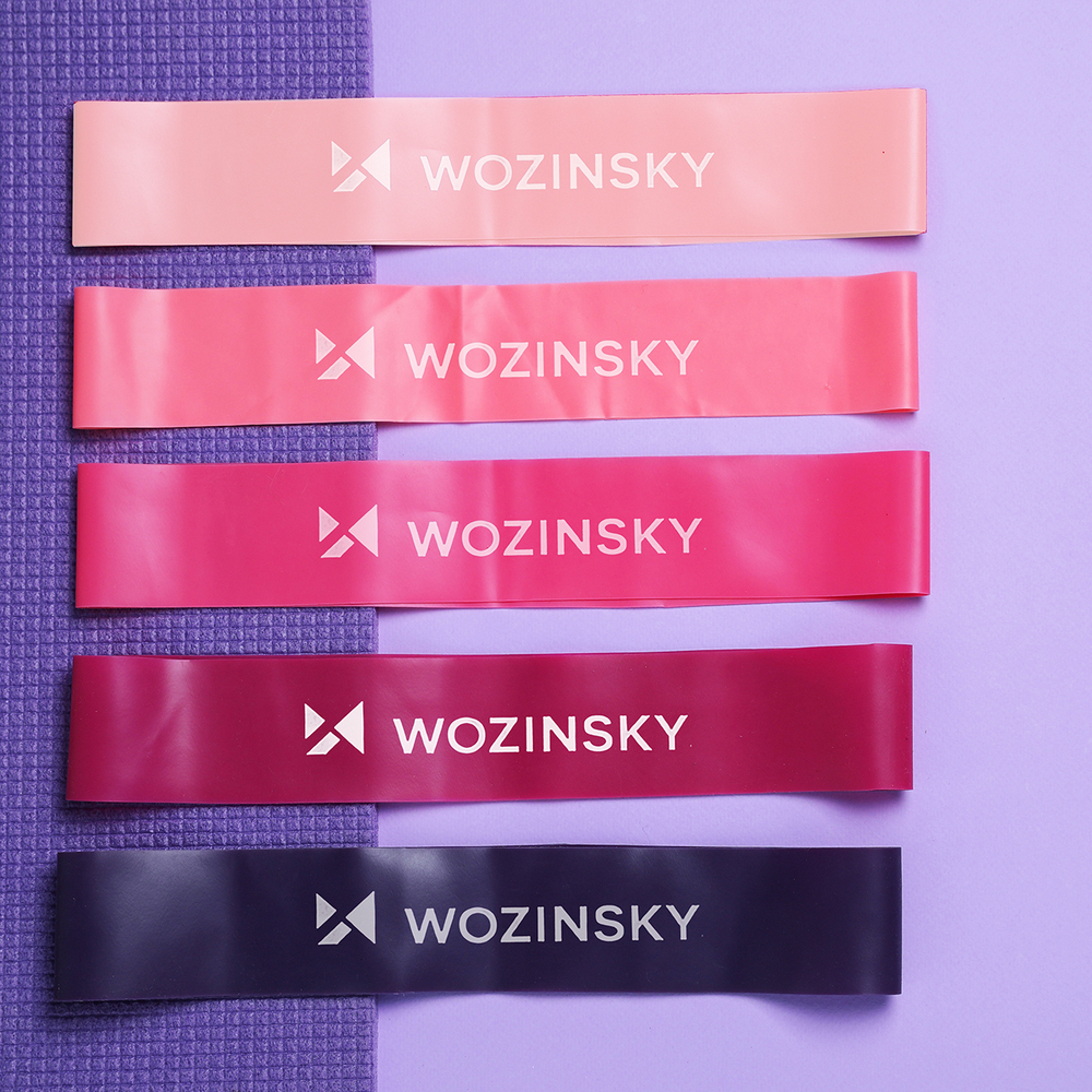 Many elastic bands on color background, flat lay and space for t